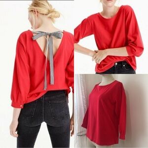 Red J.Crew blouse with a tie-back and poet sleeves